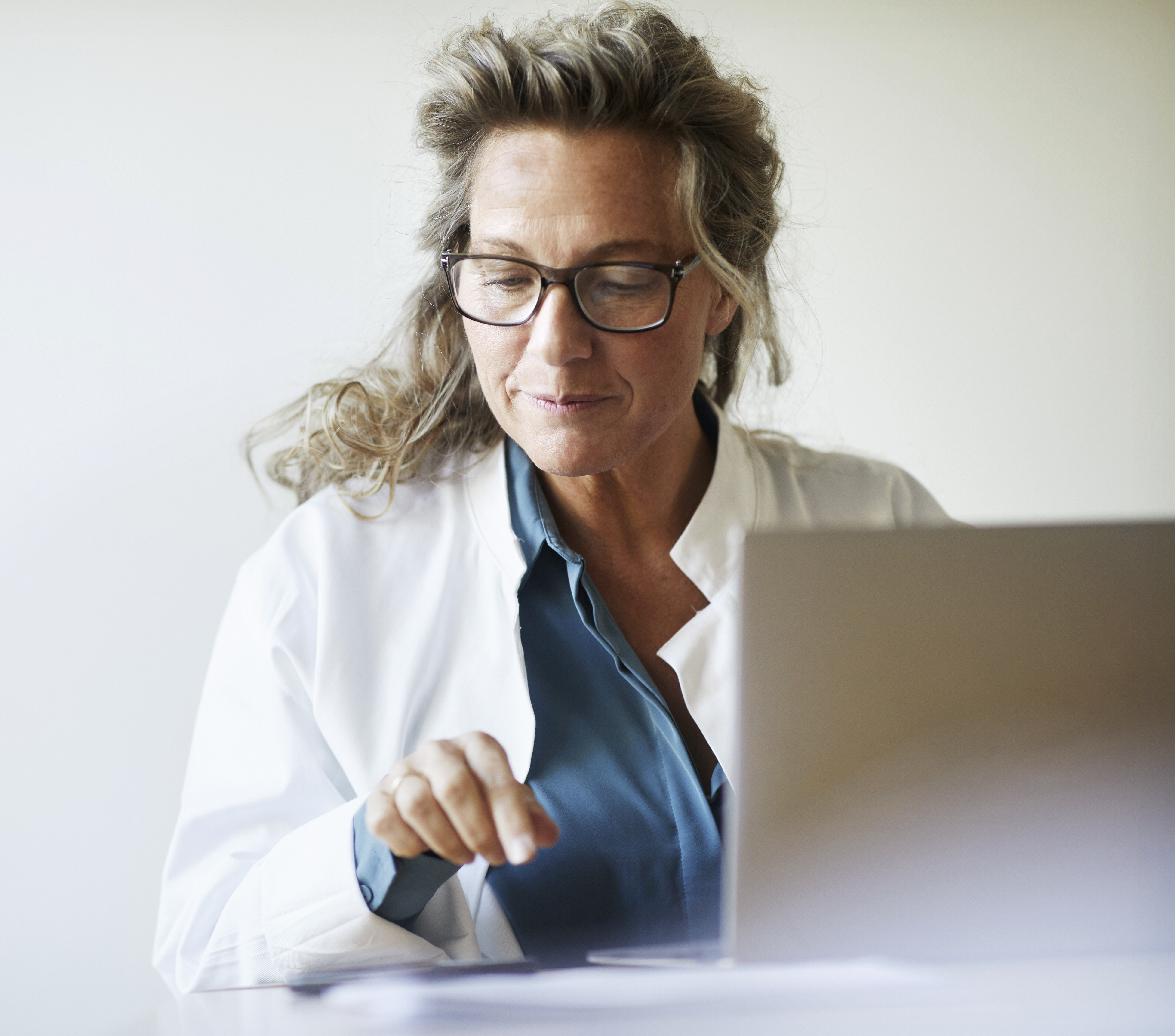 Female doctor using laptop